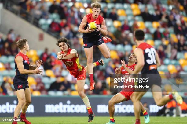 Mitch Hannan of the Demons takes a mark during the round eight AFL match between the Gold Coast Suns and the Melbourne Demons at The Gabba on May 12,...