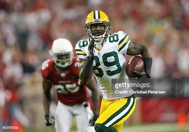 Wide receiver James Jones of the Green Bay Packers runs with the football during the 2010 NFC wild-card playoff game against the Arizona Cardinals at...