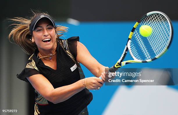 Aravane Rezai of France plays a backhand in her semi final match against Serena Williams of the USA during day five of the 2010 Medibank...