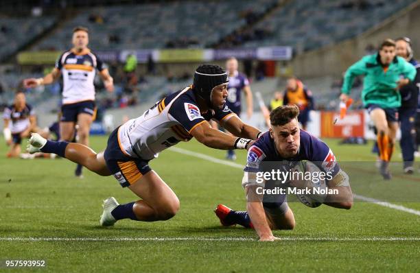 Tom English of the Rebels scores a try during the round 12 Super Rugby match between the Brumbies and the Rebels at GIO Stadium on May 12, 2018 in...