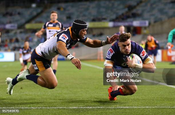 Tom English of the Rebels scores a try during the round 12 Super Rugby match between the Brumbies and the Rebels at GIO Stadium on May 12, 2018 in...