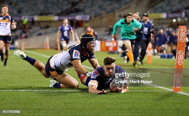 Tom English of the Rebels scores a try during the round 12 Super Rugby match between the Brumbies and the Rebels at GIO Stadium on May 12, 2018 in...