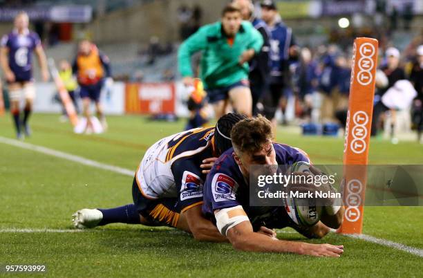 Tom English of the Rebels scores a try during the round 12 Super Rugby match between the Brumbies and the Rebels at GIO Stadium on May 12, 2018 in...