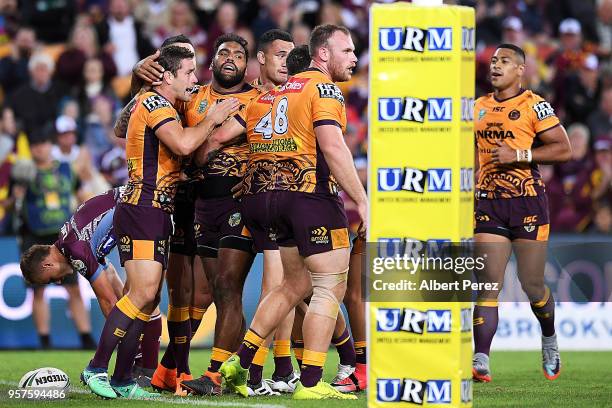 Sam Thaiday of the Broncos celebrates with team mates after scoring a try during the round ten NRL match between the Manly Sea Eagles and the...