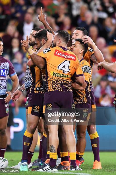 Sam Thaiday of the Broncos celebrates with team mates after scoring a try during the round ten NRL match between the Manly Sea Eagles and the...