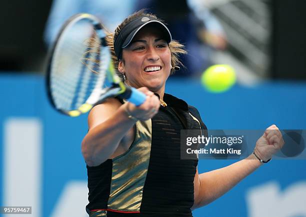 Aravane Rezai of France plays a forehand in her semi final match against Serena Williams of the USA at Sydney Olympic Park Sports Centre on January...