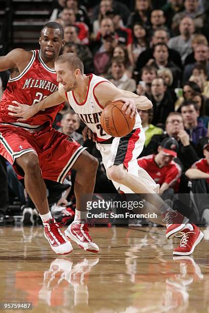 Steve Blake of the Portland Trail Blazers drives against Jodie Meeks of the Milwaukee Bucks during a game on January 13, 2010 at the Rose Garden...
