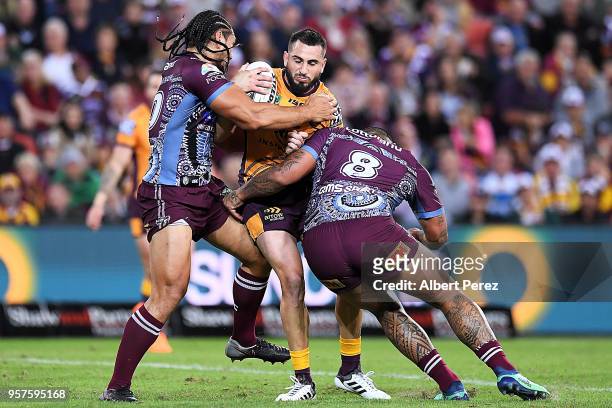 Jack Bird of the Broncos is tackled during the round ten NRL match between the Manly Sea Eagles and the Brisbane Broncos at Suncorp Stadium on May...