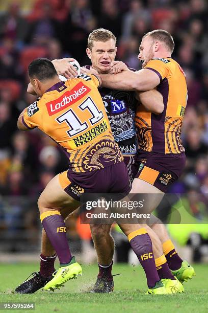 Tom Trbojevic of the Sea Eagles is tackled during the round ten NRL match between the Manly Sea Eagles and the Brisbane Broncos at Suncorp Stadium on...