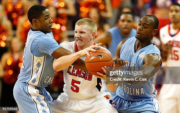 Larry Drew II and Marcus Ginyard of the North Carolina Tar Heels trap Tanner Smith of the Clemson Tigers at Littlejohn Coliseum on January 13, 2010...
