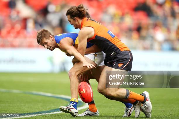 Mark LeCras of the Eagles is tackled Phil Davis of the Giants during the round eight AFL match between the Greater Western Giants and the West Coast...