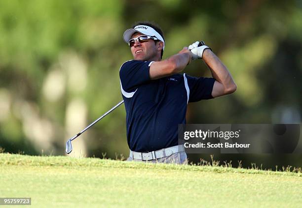 Andrew Tschudin of Australia plays an approach shot on the 1st hole during Australasia final qualifying for The Open at Kingston Heath Golf Club on...