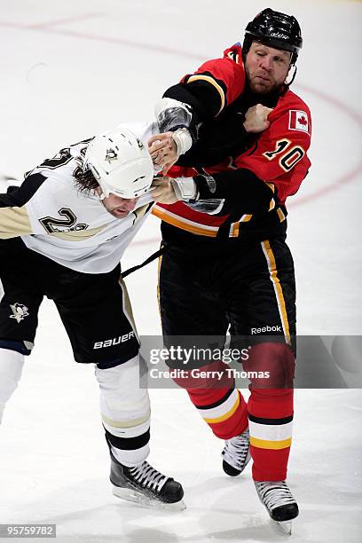 Brian McGrattan of the Calgary Flames fights Eric Godard of the Pittsburgh Penguins on January 13, 2010 at Pengrowth Saddledome in Calgary, Alberta,...