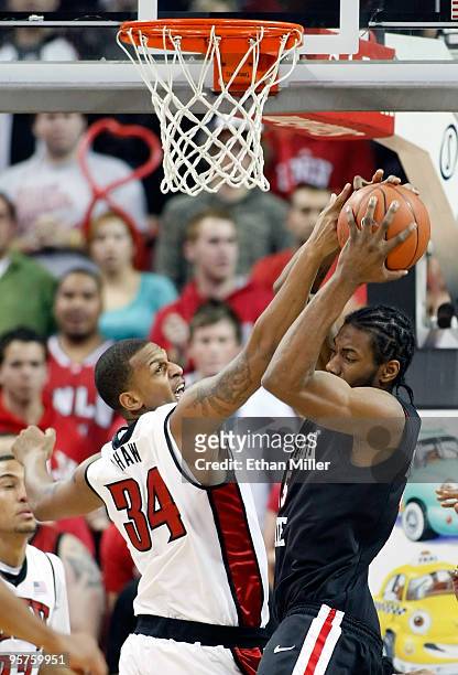Matt Shaw of the UNLV Rebels and Kawhi Leonard of the San Diego State Aztecs fight for a rebound during their game at the Thomas & Mack Center...