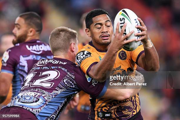 Anthony Milford of the Broncos is tackled during the round ten NRL match between the Manly Sea Eagles and the Brisbane Broncos at Suncorp Stadium on...