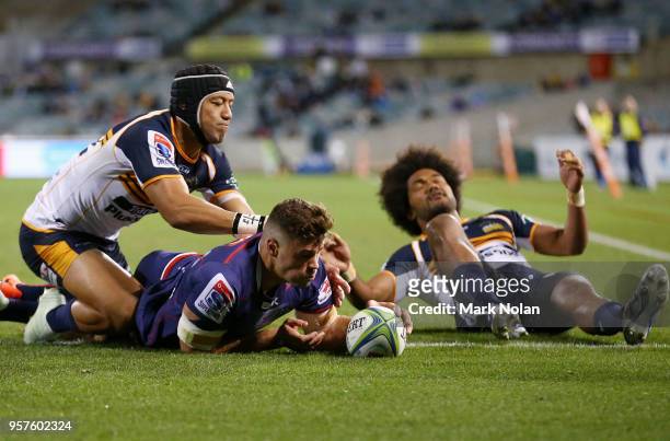 Tom English of the Rebels scores a try during the round 12 Super Rugby match between the Brumbies and the Rebels at GIO Stadium on May 12, 2018 in...