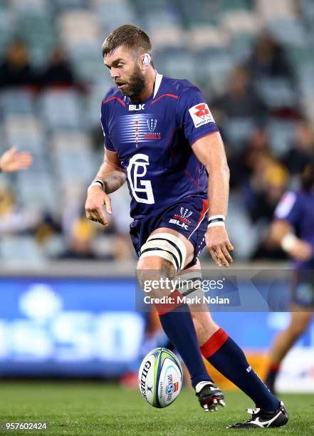 Geoff Parling of the Rebels attempts to kick ahead during the round 12 Super Rugby match between the Brumbies and the Rebels at GIO Stadium on May...