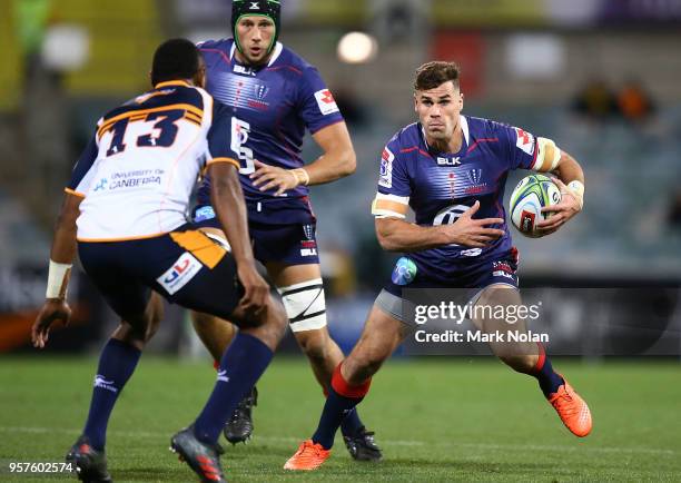 Tom English of the Rebels runs the ball during the round 12 Super Rugby match between the Brumbies and the Rebels at GIO Stadium on May 12, 2018 in...