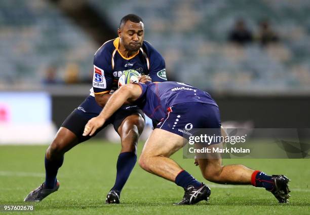 Tevita Kuridrani of the Brumbies is tackled during the round 12 Super Rugby match between the Brumbies and the Rebels at GIO Stadium on May 12, 2018...