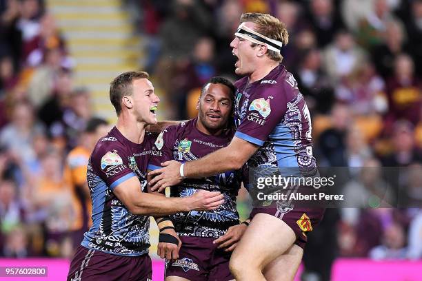 Apisai Koroisau of the Sea Eagles celebrates with team mates after scoring a try during the round ten NRL match between the Manly Sea Eagles and the...