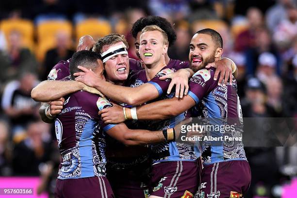 Manly Sea Eagles players celebrate a Apisai Koroisau try during the round ten NRL match between the Manly Sea Eagles and the Brisbane Broncos at...