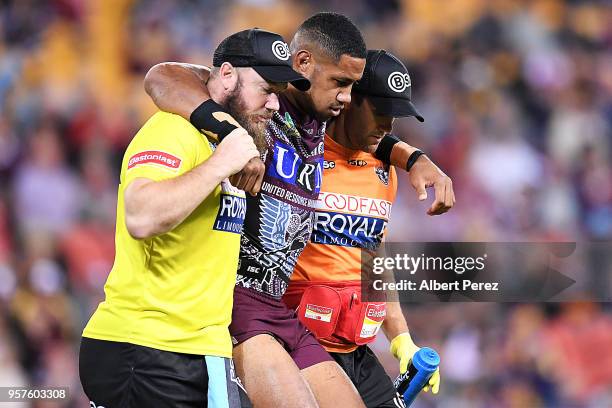 Taniela Paseka of the Sea Eagles is carried off the field injured during the round ten NRL match between the Manly Sea Eagles and the Brisbane...