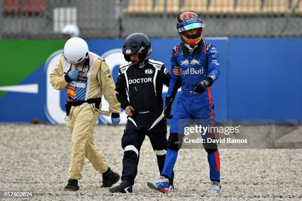 Brendon Hartley of New Zealand and Scuderia Toro Rosso walks from his car after crashing during final practice for the Spanish Formula One Grand Prix...