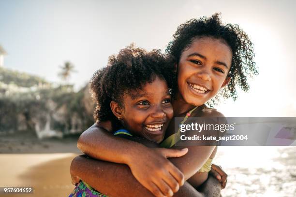 summer fun - african girls on beach stock pictures, royalty-free photos & images