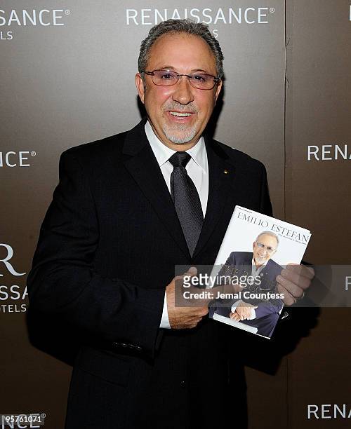 Music industry legend Emilio Estefan poses for photos during the launch party for his book, "The Rhythm of Success: How an Immigrant Produced his own...