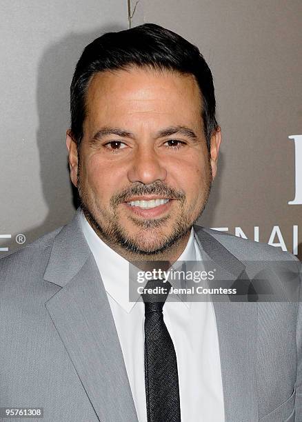 Fashion designer Narciso Rodriguez poses for photos during the launch party for Emilio Estefan's book, "The Rhythm of Success: How an Immigrant...