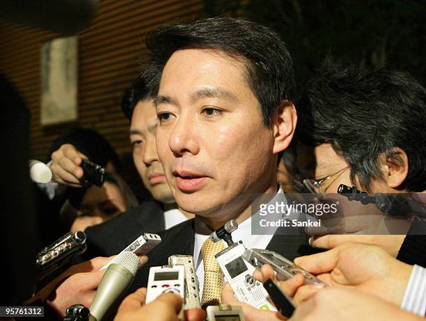 Transport Minister Seiji Maehara is surrounded by reporters after his meeting with Kyocera Corporation Honorary Chairman and Founder Kazuo Inamori...