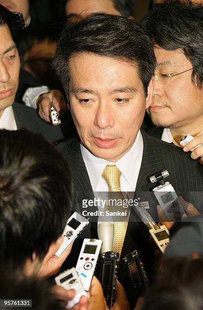 Transport Minister Seiji Maehara is surrounded by reporters after his meeting with Kyocera Corporation Honorary Chairman and Founder Kazuo Inamori...