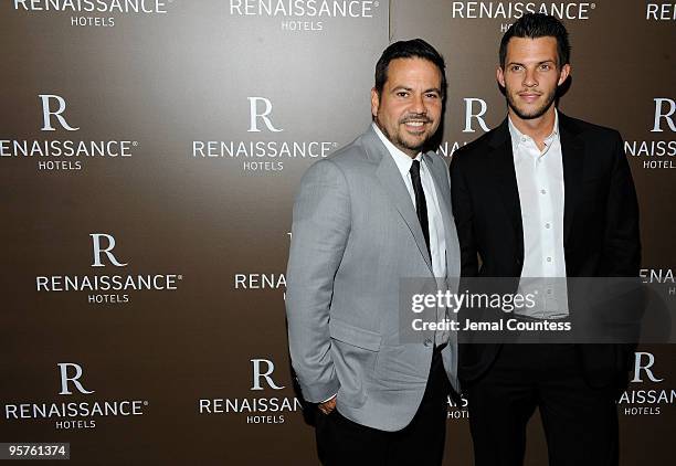 Fashion designer Narciso Rodriguez and Thomas Tolan pose for photos during the launch party for Emilio Estefan's book, "The Rhythm of Success: How an...