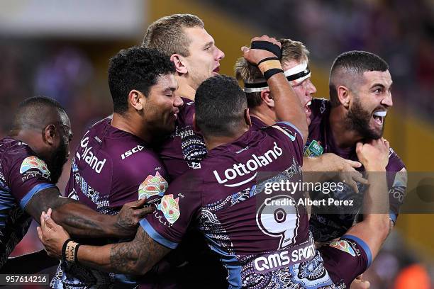 Manly Sea Eagles players celebrate a Joel Thompson try during the round ten NRL match between the Manly Sea Eagles and the Brisbane Broncos at...