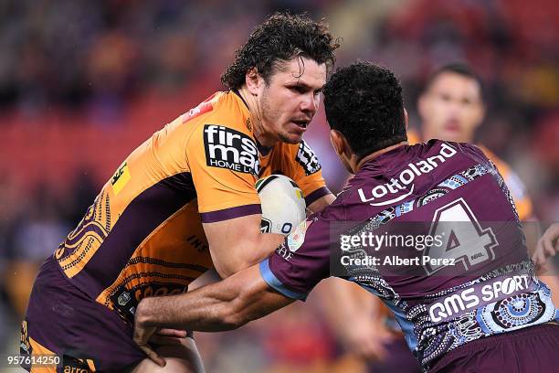 James Roberts of the Broncos takes on the defence during the round ten NRL match between the Manly Sea Eagles and the Brisbane Broncos at Suncorp...