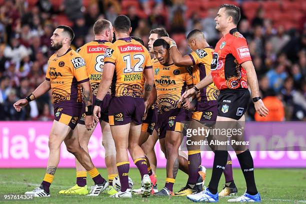 Anthony Milford of the Broncos is congratulated by team mates after scoring a try during the round ten NRL match between the Manly Sea Eagles and the...