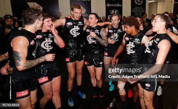 Blues players sing the team song during the 2018 AFL round eight match between the Carlton Blues and the Essendon Bombers at the Melbourne Cricket...