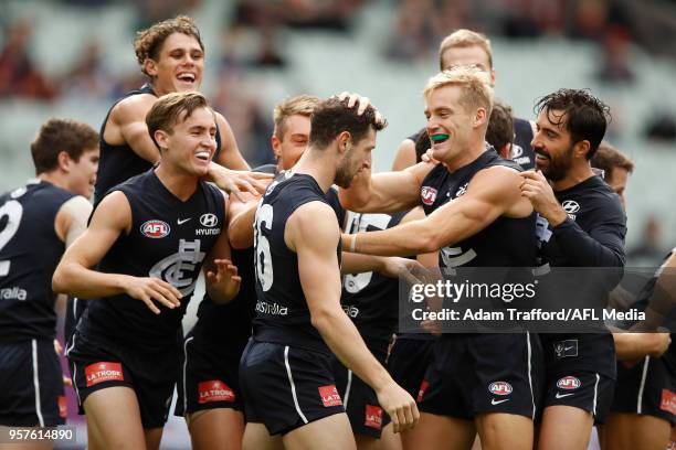 Darcy Lang of the Blues celebrates his first goal as a blue with teammates during the 2018 AFL round eight match between the Carlton Blues and the...