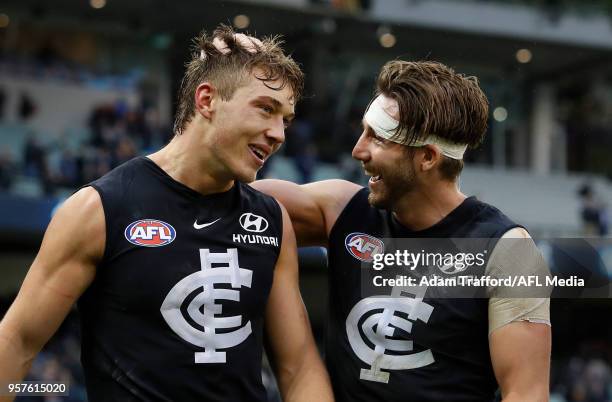 Patrick Cripps of the Blues celebrates with Dale Thomas of the Blues during the 2018 AFL round eight match between the Carlton Blues and the Essendon...