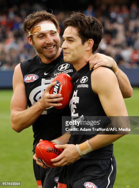 Dale Thomas of the Blues celebrates with Zac Fisher of the Blues during the 2018 AFL round eight match between the Carlton Blues and the Essendon...