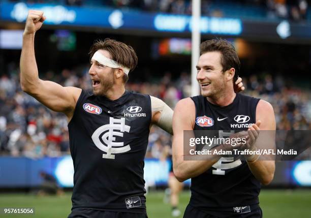 Dale Thomas and Jed Lamb of the Blues thank fans during the 2018 AFL round eight match between the Carlton Blues and the Essendon Bombers at the...