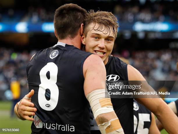 Patrick Cripps of the Blues celebrates with Matthew Kreuzer of the Blues during the 2018 AFL round eight match between the Carlton Blues and the...