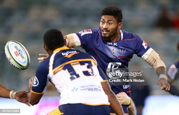 Amanaki Mafi of the Rebels offloads during the round 12 Super Rugby match between the Brumbies and the Rebels at GIO Stadium on May 12, 2018 in...