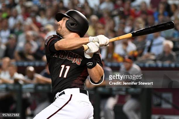 Pollock of the Arizona Diamondbacks hits a sacrifice fly ball in the first inning of the MLB game against the Houston Astros at Chase Field on May 5,...