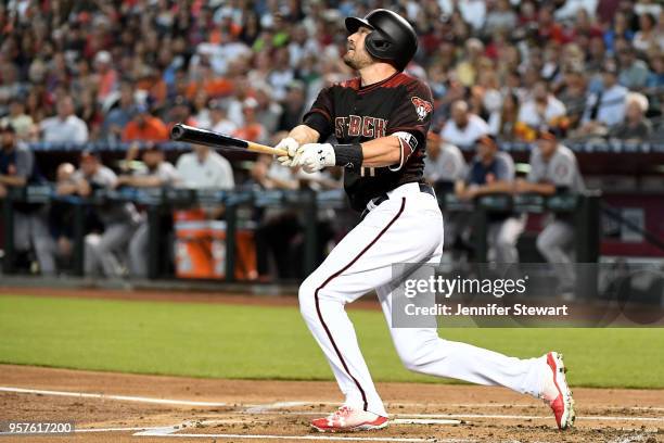 Pollock of the Arizona Diamondbacks hits a sacrifice fly ball in the first inning of the MLB game against the Houston Astros at Chase Field on May 5,...