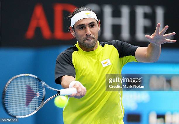 Marcos Baghdatis of Cyprus plays a forehand in his quarter final match against Lleyton Hewitt of Australia during day five of the 2010 Medibank...