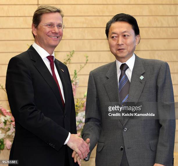 German Foreign Minister and Deputy Chancellor Guido Westerwelle shakes hands with Japanese Prime Minister Yukio Hatoyama prior to their meeting at...