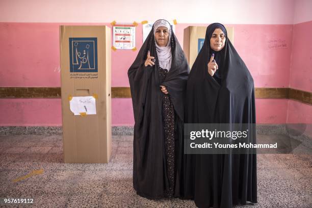 Voters head to polling stations to cast their vote for the Iraqi parliamentary election on May 12, 2018 in Erbil, Iraq. Citizens are voting in the...