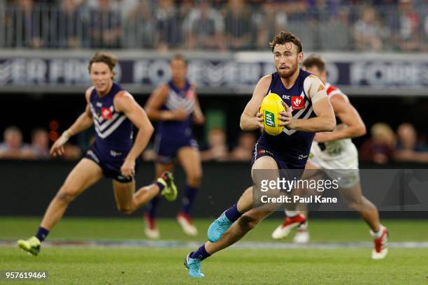 Connor Blakely of the Dockers looks to pass the ball during the round eight AFL match between the Fremantle Dockers and the St Kilda Saints at Optus...