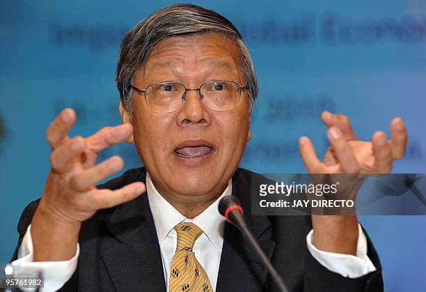 Andrew Sheng, chief advisor of China Banking Regulatory Commission gestures as he addresses a forum on the global financial crisis at the Asian...